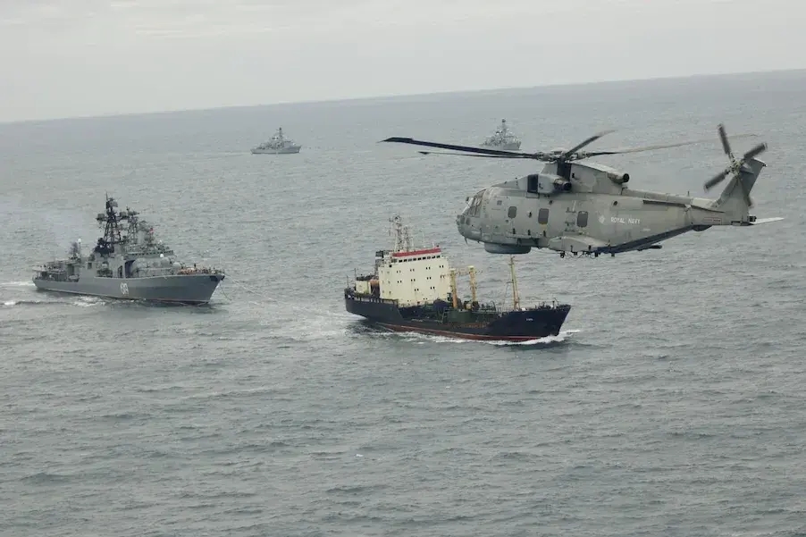 HMS Somerset (back right) and HMS St Albans (back left) with a Merlin helicopter track the Russian destroyer Severomorsk and tanker Kama in the Channel. Photo: UK Ministry of Defence