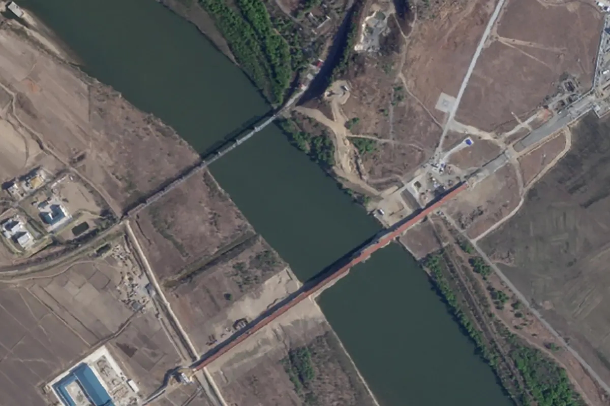 Photo: The road bridge across the Tumen River and, above it, the only rail crossing between Russia and North Korea, the “Friendship Bridge.” Source: Truth Hounds / Planet Labs PBC