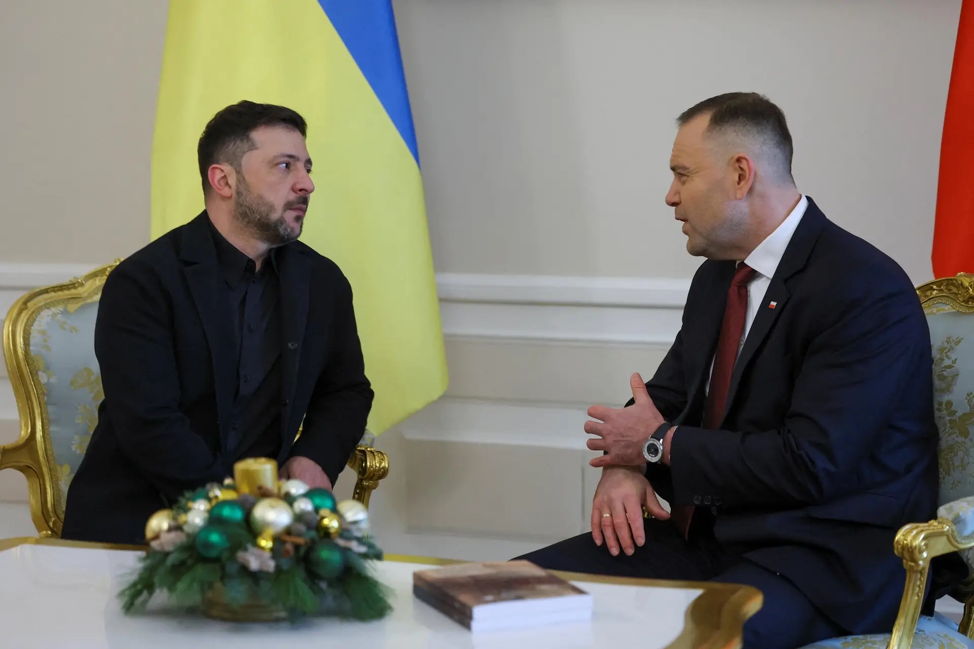Polish President Karol Nawrocki gives Ukrainian President Volodymyr Zelenskyy the two-volume Documents of the Volhynia Massacre collection.
