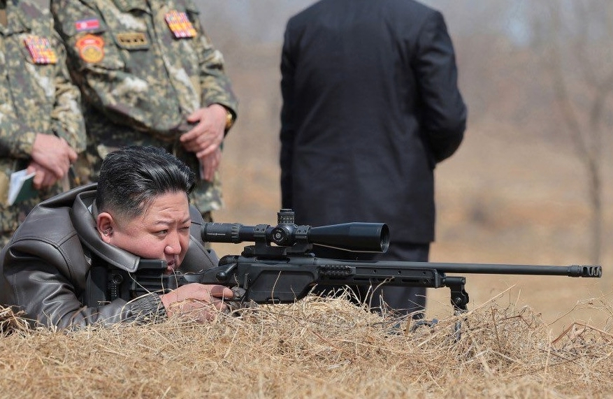 Kim Jong Un with a new sniper rifle, April 2025. Photo: KCNA