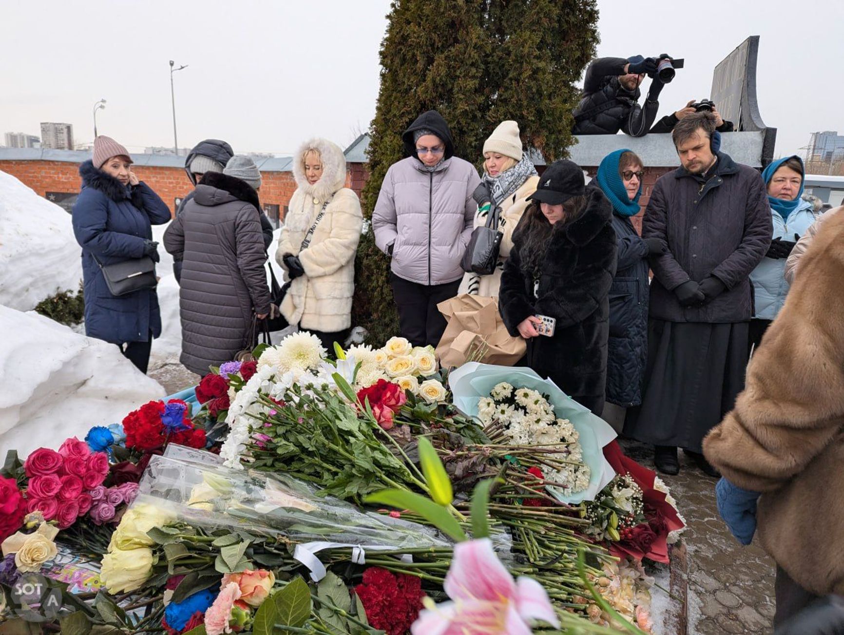 Dozens of people, including Navalny’s mother and mother-in-law — Lyudmila Navalnaya and Alla Abrosimova — came to his grave to pay their respects on the second anniversary of his death.