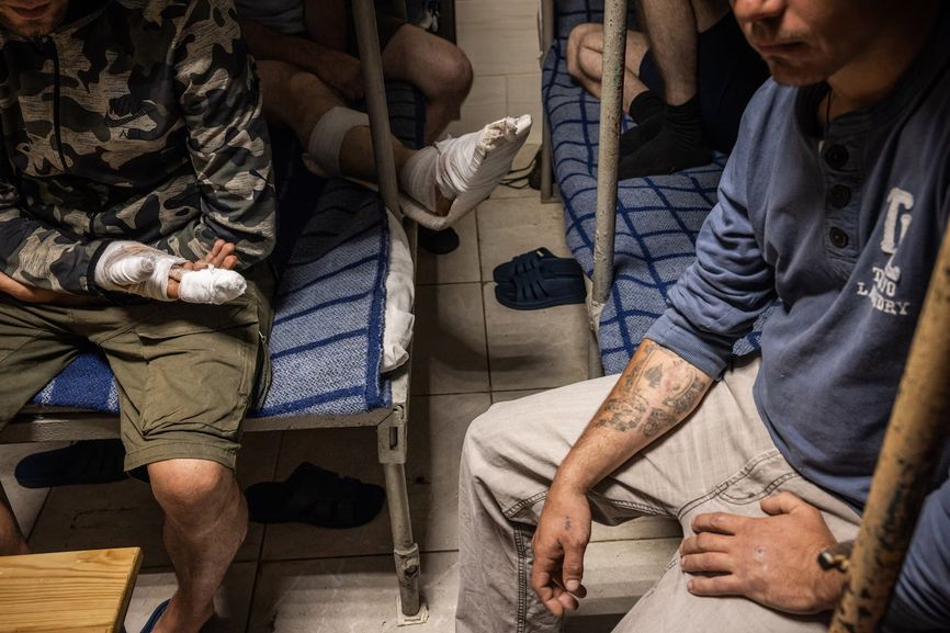 Captured Russian soldiers and border guards held in a cell at a Ukrainian prison in northeastern Ukraine